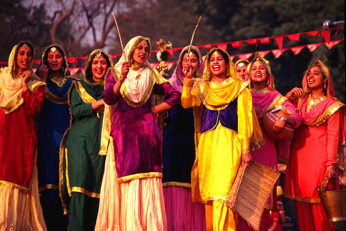 Energetic Bhangra group performance with coordinated movements